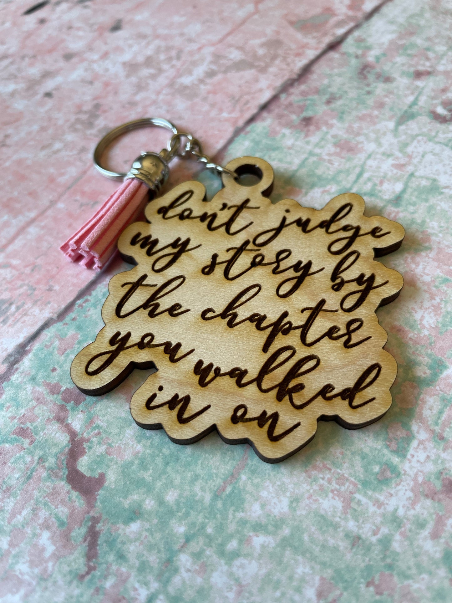 Don't judge a story wood keychain